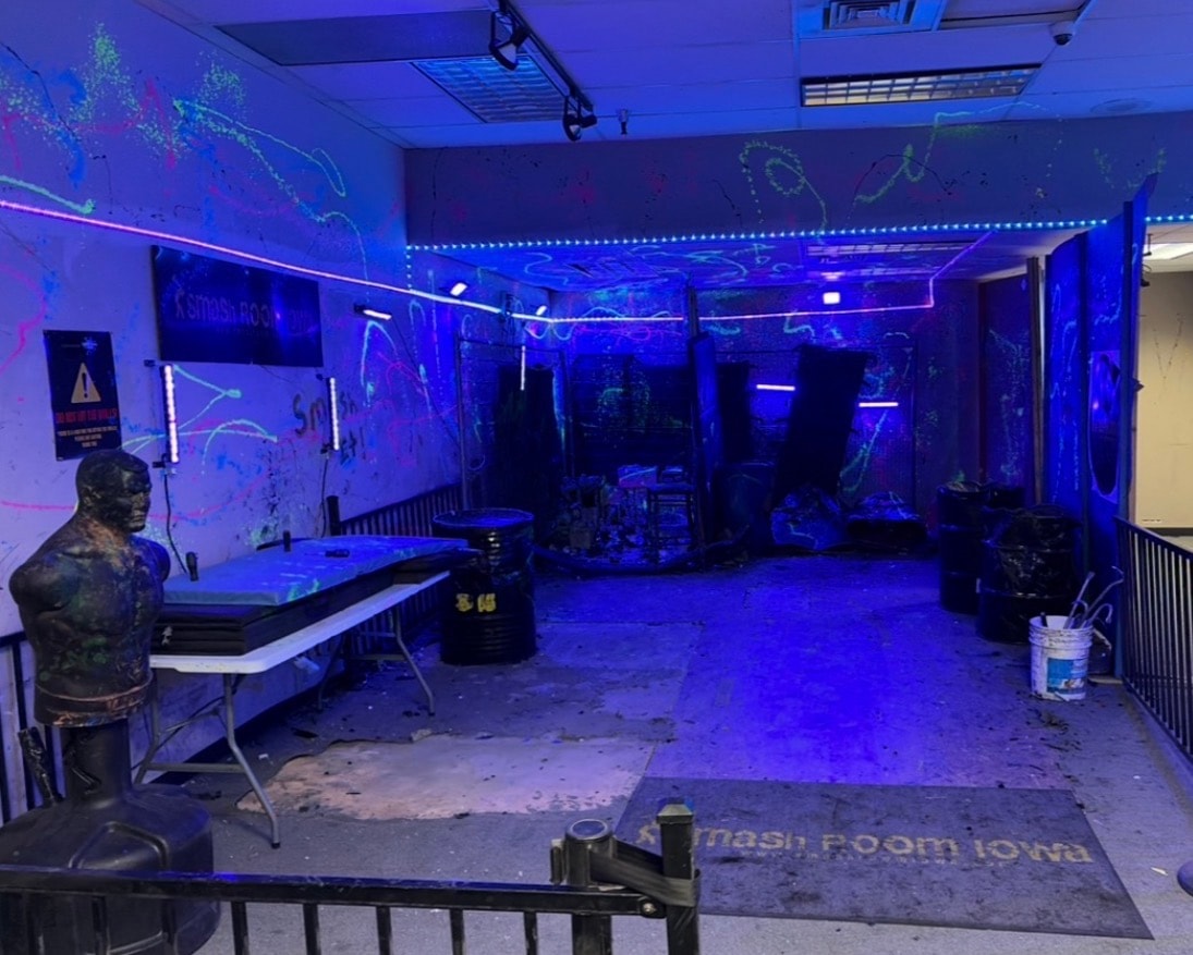 Glow Smash — neon blacklight rage room experience at Smash Room Iowa in Des Moines